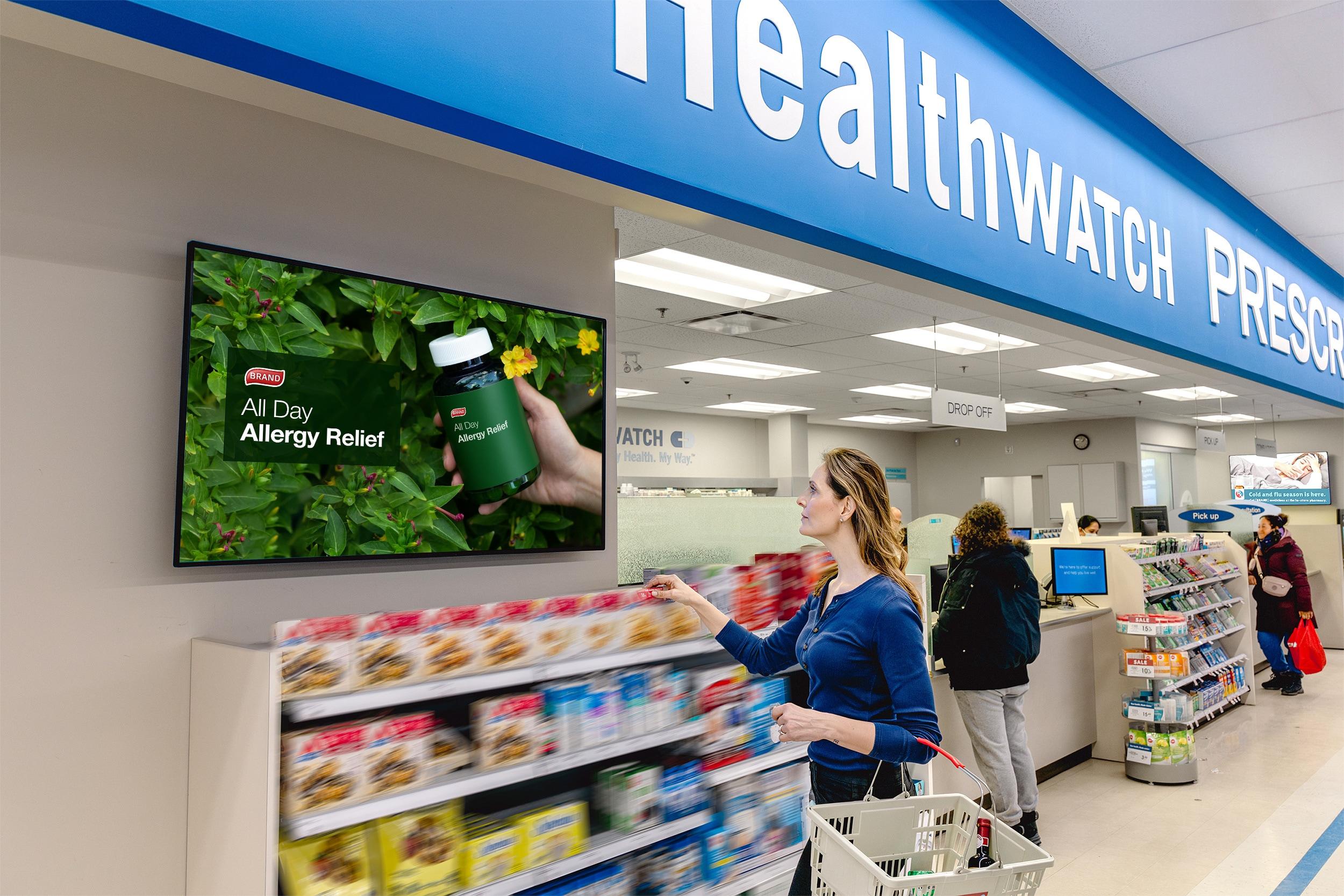 Shopper viewing retail media ad in a store